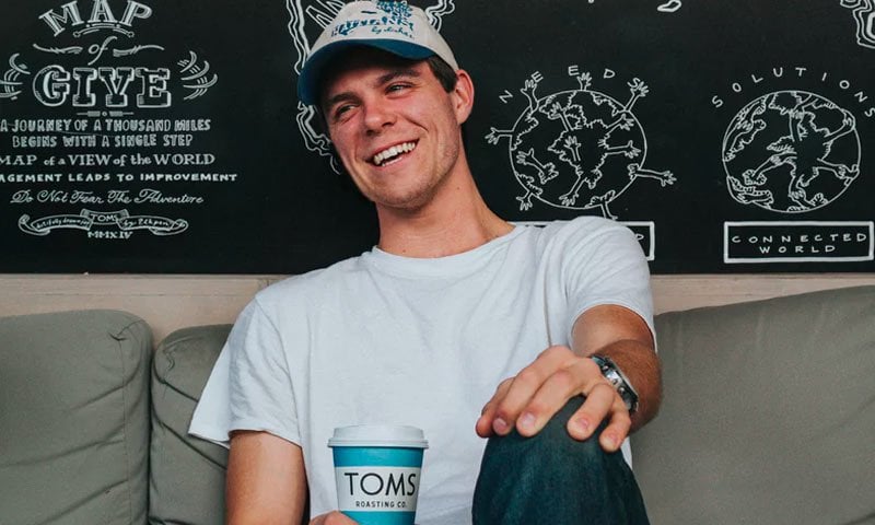 Smiling male customer in white T-shirt